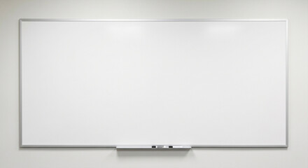 Clean and empty large whiteboard with an aluminum frame mounted on a plain white wall. A small tray at the bottom holds dry-erase markers and an eraser. This minimalist classroom or boardroom setup of © Leonardo