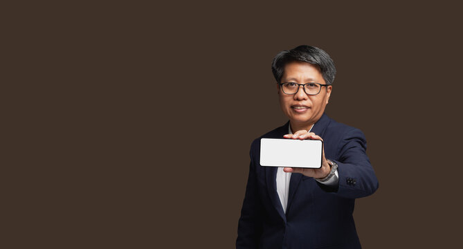Business woman holding smartphone with blank screen