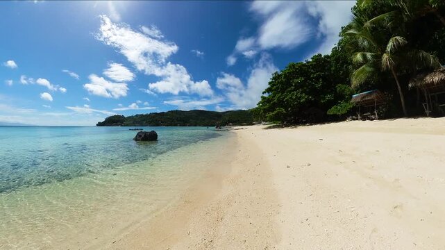 Tropical white sand with clear sea water and corals in Tiamban Beach. Romblon Island. Philippines.