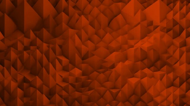 A dynamic 3D motion graphic loop showcasing a low poly sharp landscape covered in dark orange and warm brown crystalline pyramids. The subtle shifting movement of the polygonal peaks creates a high-co