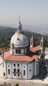 Vertical aerial drone orbit shot of the Sameiro Sanctuary in the city of Braga, Portugal.