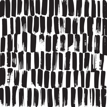 Artistic seamless pattern of varied black vertical hand painted brush strokes on a clean white surface