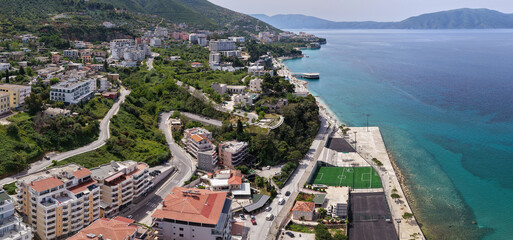Panoramic Aerial Image of Vlora Coastline, Waterfront Sports Fields and Turquoise Ionian Sea © bardhok