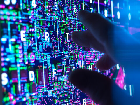 Hand typing at futuristic AI keyboard with cybersecurity interface