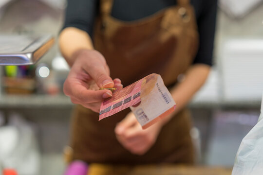 Butchery, female butcher with change