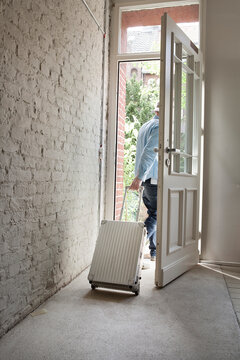 Mature man holding luggage