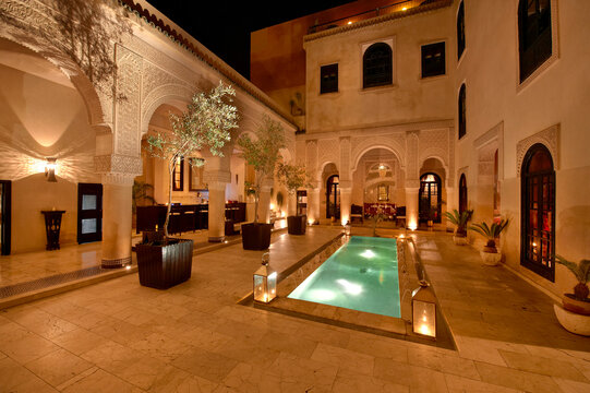 Morocco, Fes, Hotel Riad Fes, courtyard with lightened pool by night