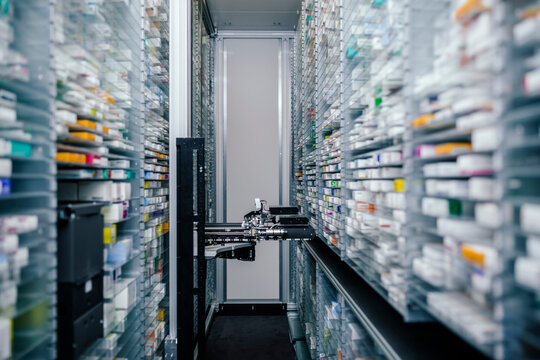 Medicine in shelves in commissioning machine in pharmacy