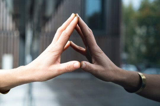 Woman's hand touching glass pane