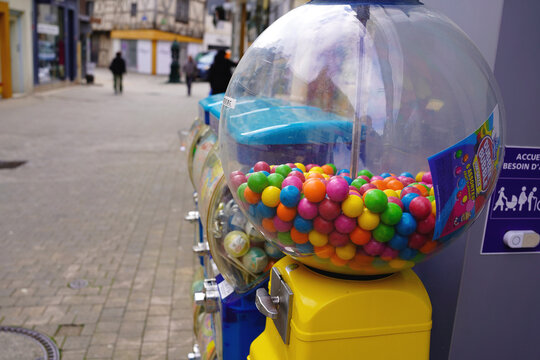 BOURGES, FRANCE - MAY 12, 2026: Colorful gumball machine on city pedestrian street.