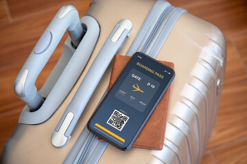 Mobile phone with digital boarding pass at airport and luggage