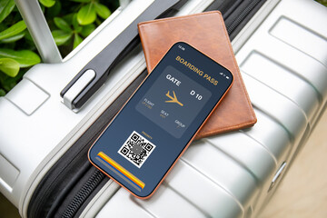 Mobile phone with digital boarding pass at airport and luggage © DenPhoto