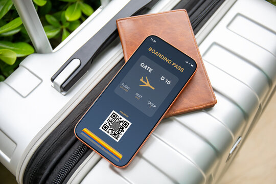 Mobile phone with digital boarding pass at airport and luggage