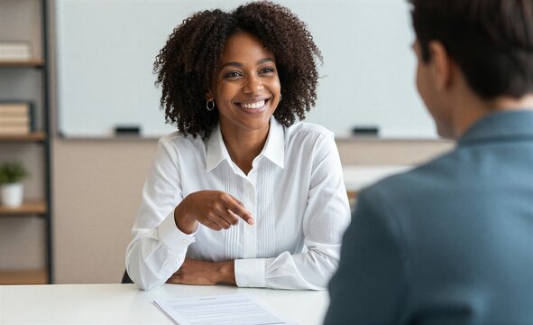 Smiling woman in white shirt engages warmly with a man during