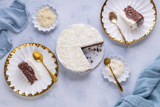 Healthy vegan and gluten free chocolate coconut cake on kitchen table