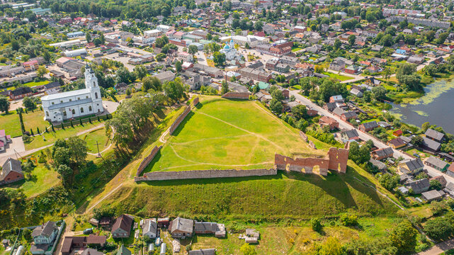 Aerial photo from drone of the city of Ludza. In the background, the Ludza Medieval Castle, the city's churches, and lakes are visible on a sunny summer day. Ludza, Latgale, Latvia. 