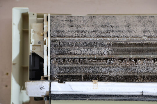 Dirty Air Conditioner Evaporator Coil Covered With Dust and Mold