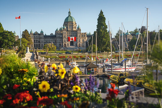 Victoria Inner Harbour view with British Columbia Parliament and flowers - Victoria, British Columbia, Canada