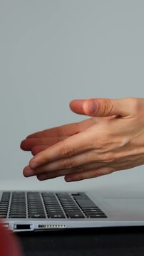 Accelerated typing sequence employing rhythmic finger movements and concentrated effort. Speedy keystroke activity on modern desk setup emphasizing digital focus and precise finger coordination