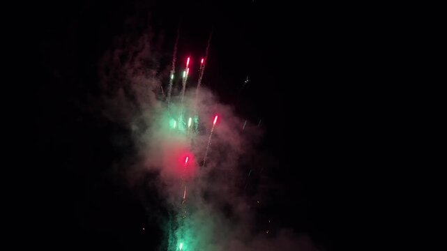 Beautiful colorful fireworks exploding in the night sky during a festival celebration