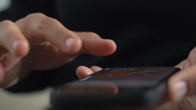 A woman uses a phone to edit a video.	
