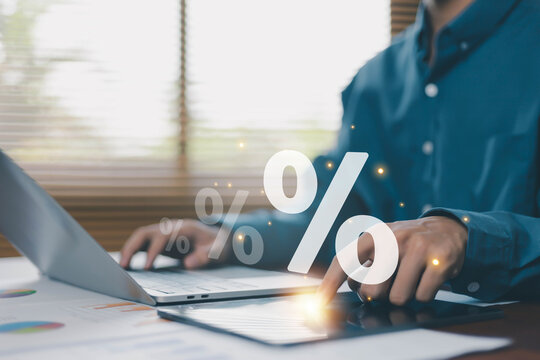 Business finance and percentage analysis concept with professional using tablet and laptop, representing financial data, investment growth, tax calculation, sales performance and digital analytics.
