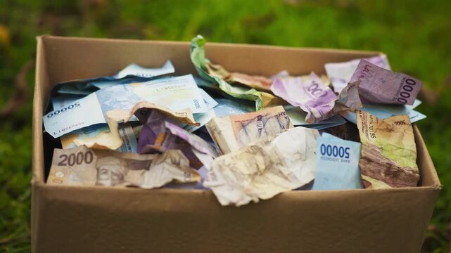 Stack of Indonesian Rupiah Donation Money Close Up