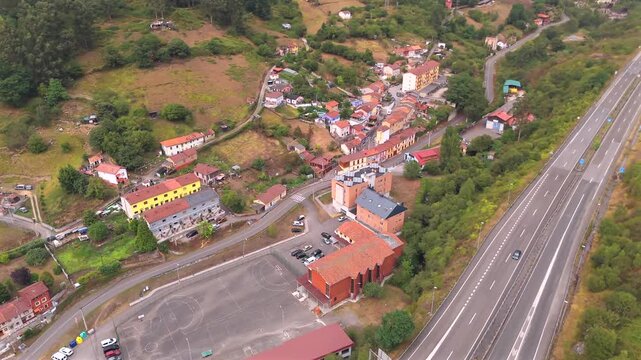 Drone aerial view of rural village and mountain houses near Mieres del Camin Asturias