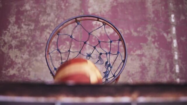 Close-Up of Basketball Hoop with Ball Scoring