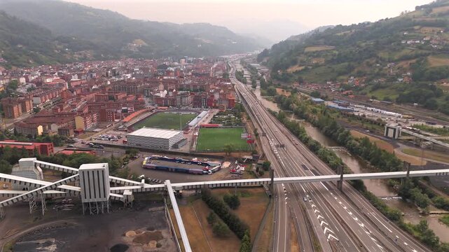 Drone aerial view of mining town and mountain houses near La Pena Asturias