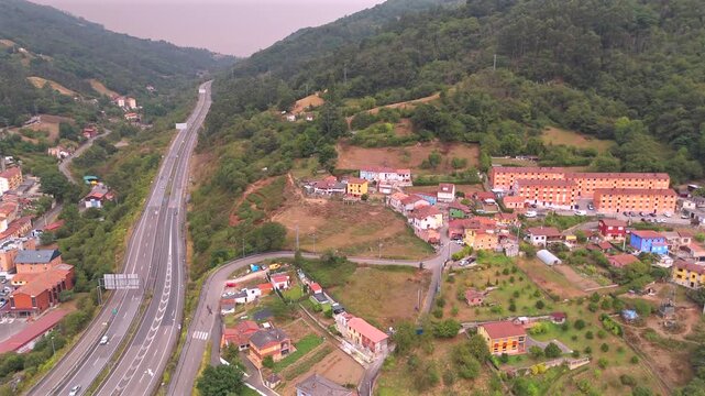 Drone aerial view of countryside landscape and mountain houses near La Pena Asturias
