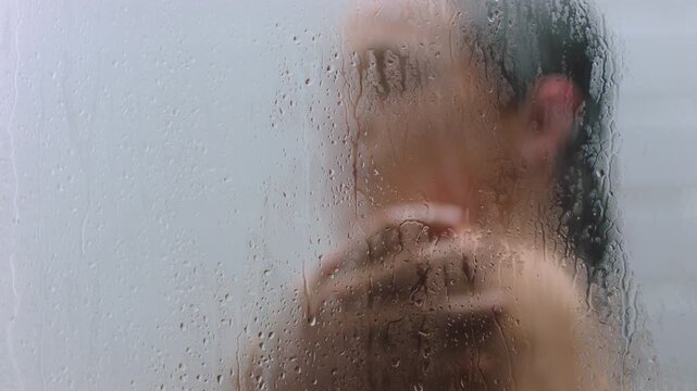 Glass, steam and woman with body care in shower for personal hygiene, hydration and wellness. Water drops, person and grooming routine in home for skincare, cleanliness, and washing for skin health