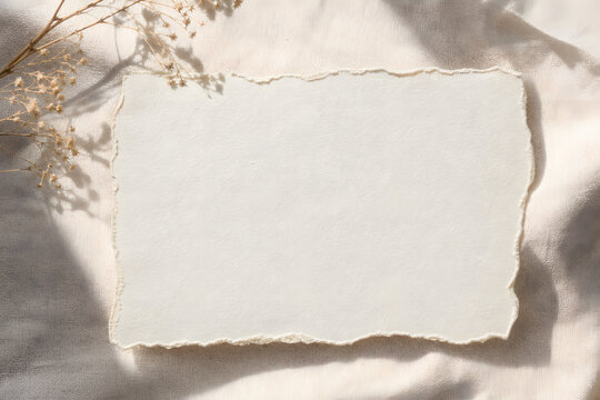 Torn Paper Sheet on Linen in Warm Light