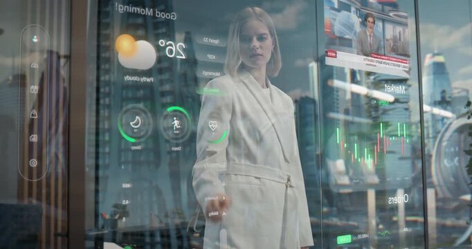 Businesswoman in Suit Watches Futuristic City Through Smart Glass Window with Holographic Dashboard Showing Weather, Fitness, News, Market Charts, Visualizing Smart Data