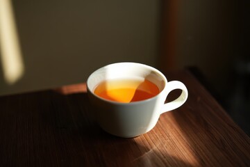 Fototapeta premium Warm Cup of Tea in Morning Sunlight