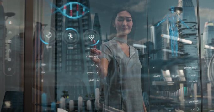 Asian Woman Interacts With Futuristic Holographic Interface Displaying Health Data, Heart, Biometrics on Transparent Window Overlooking a Sci-fi City With Flying cars. Medium Shot