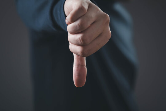 Customer dissatisfaction concept with thumbs down gesture, representing negative feedback, poor service, bad review, low rating and business quality issues in customer experience and digital marketing