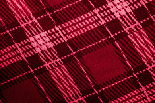 Red and dark maroon plaid fabric texture with checkered tartan pattern