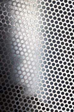 Textured perforated metal sheet background