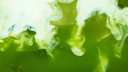 Pour of Milk Into Iced Matcha Latte © Lukas Gojda