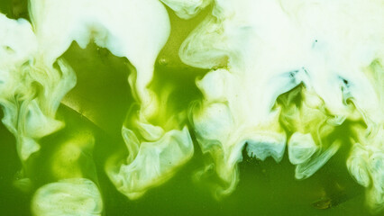 Pour of Milk Into Iced Matcha Latte © Lukas Gojda