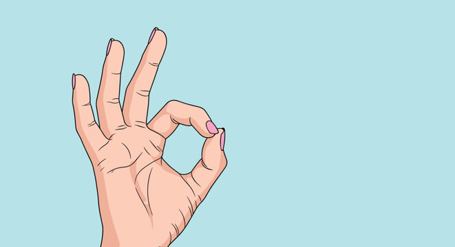 Close up of a female hand making the okay sign gesture with pink fingernails against a solid light blue background.