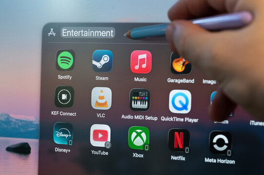Selecting computer entertainment app on screen menu