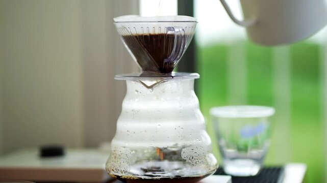 pour over coffee brewing method whole process wood and concrete background trendy cool shadows natural light background