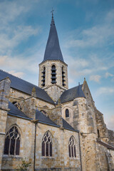 Obraz premium The Church of Notre-Dame de Puiseaux is an imposing 13th-century Gothic church, famous for its distinctive spiral spire and historical significance, France