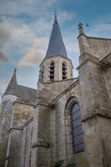 Obraz premium The Church of Notre-Dame de Puiseaux is an imposing 13th-century Gothic church, famous for its distinctive spiral spire and historical significance, France