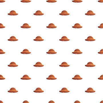 Safari hats and pith helmets forming a repeating pattern on a white background