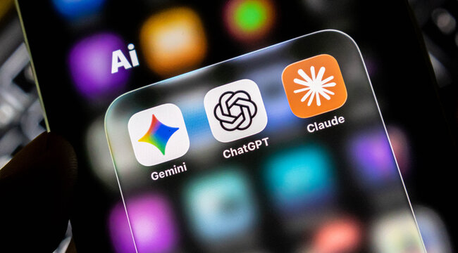 Closeup of a smartphone screen displaying popular artificial intelligence mobile application icons including gemini, chatgpt, and claude