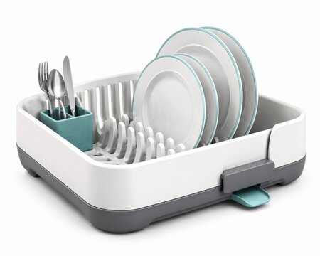 Modern dish drying rack with plates and cutlery on white
