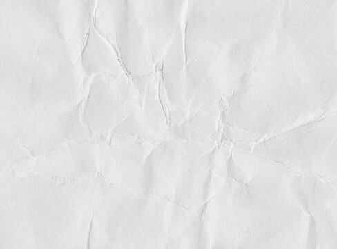 Crumpled paper texture with irregular wrinkles, intersecting creases, compressed center folds, and natural fiber detail, expressive scanned sheet surface for collage and graphic work